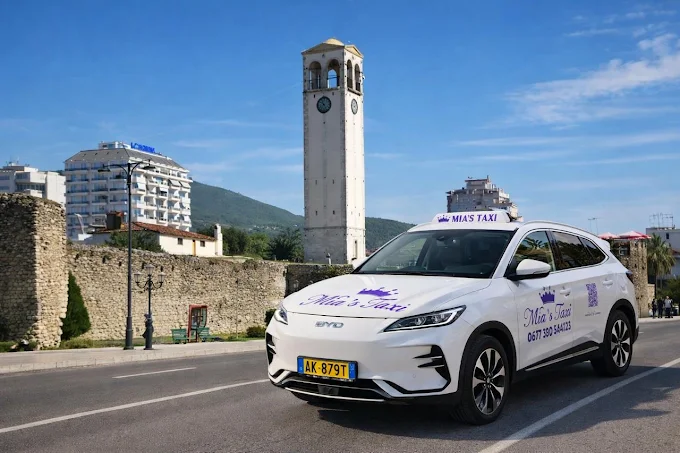 Mia's Taxi near the Elbasan clock tower